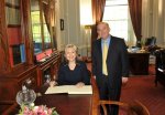 Mrs Hilary Clinton signs the Visitors Book